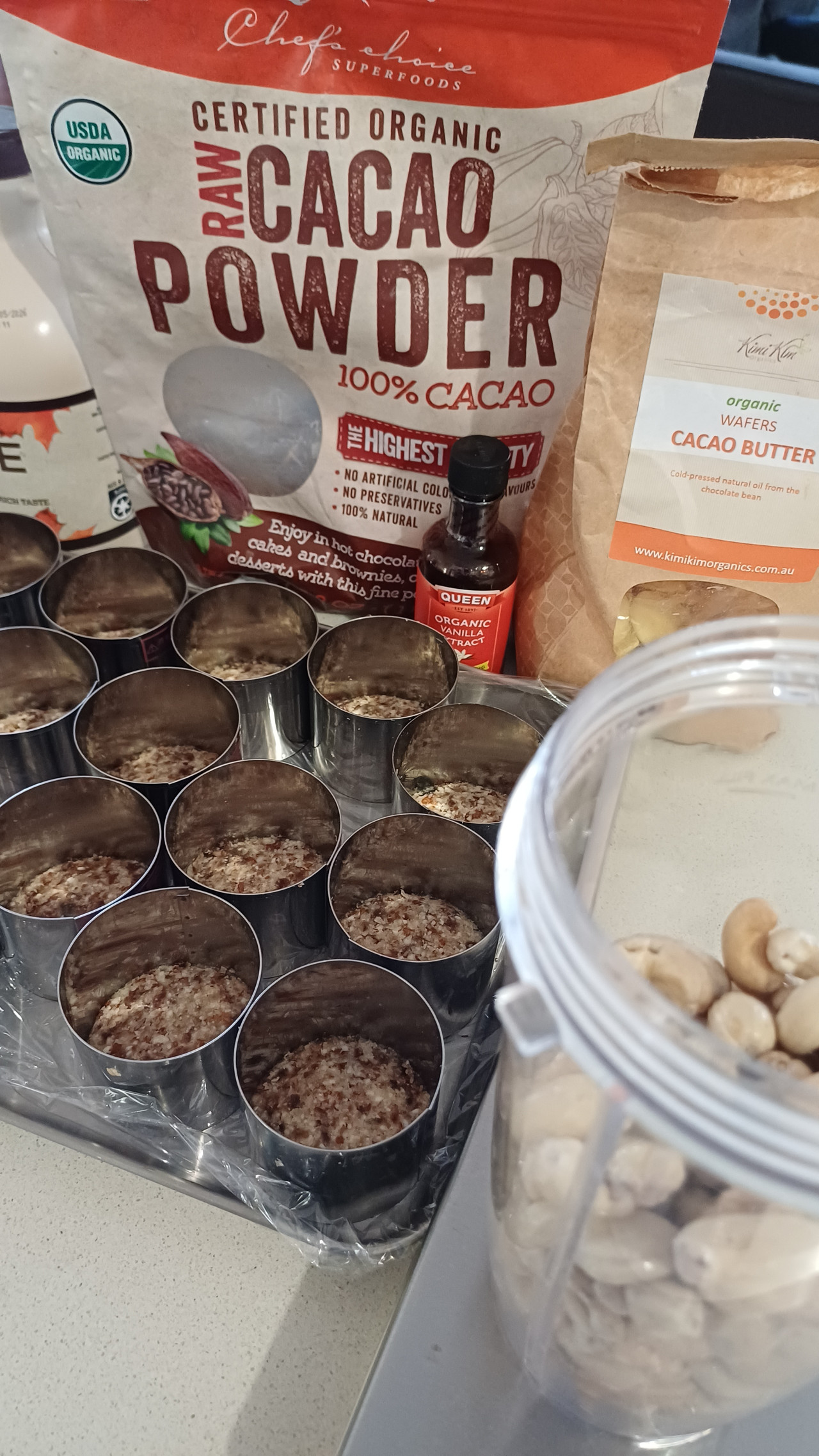 Assortment of raw vegan cake ingredients including cashews and dates